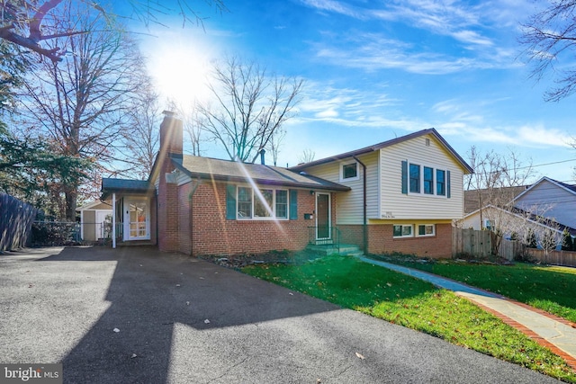 split level home with a front yard