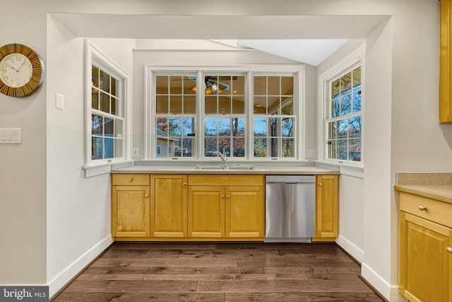 bar featuring dishwasher, dark hardwood / wood-style flooring, and sink