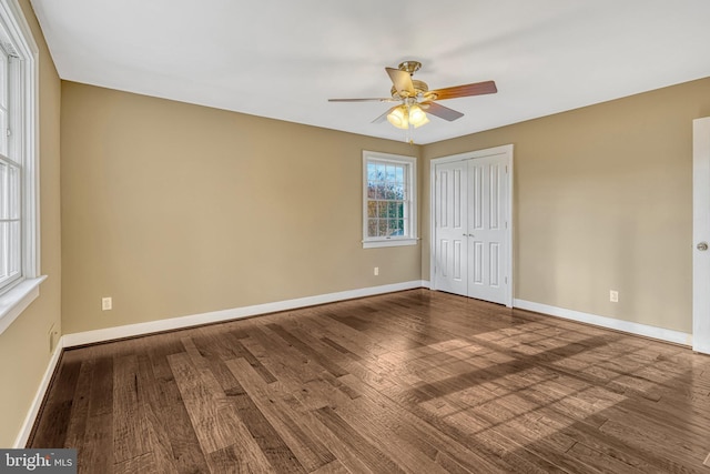 empty room featuring hardwood / wood-style floors and ceiling fan