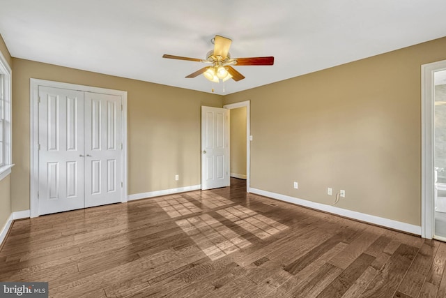 unfurnished bedroom with hardwood / wood-style flooring, ceiling fan, and a closet