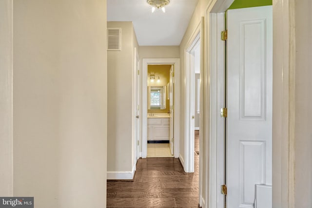 hall with dark hardwood / wood-style flooring