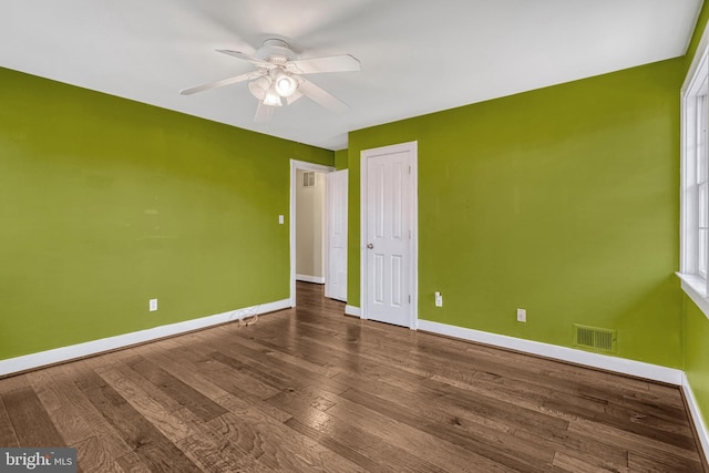 unfurnished bedroom with hardwood / wood-style floors, a closet, and ceiling fan