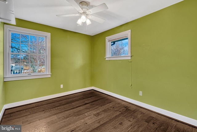 spare room featuring hardwood / wood-style flooring and ceiling fan