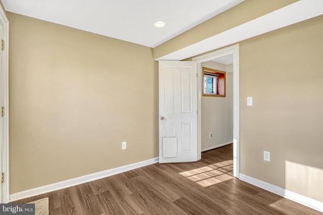 empty room with wood-type flooring