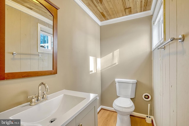 bathroom featuring ornamental molding, wood ceiling, vanity, hardwood / wood-style floors, and toilet