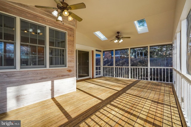 unfurnished sunroom with vaulted ceiling and ceiling fan