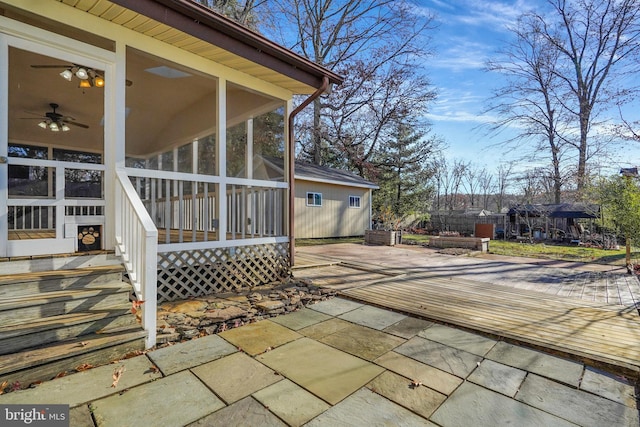 view of patio / terrace featuring a sunroom