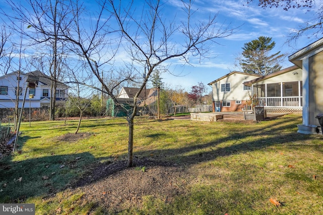 view of yard with a sunroom