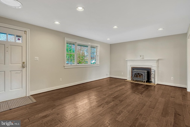 unfurnished living room with dark hardwood / wood-style floors