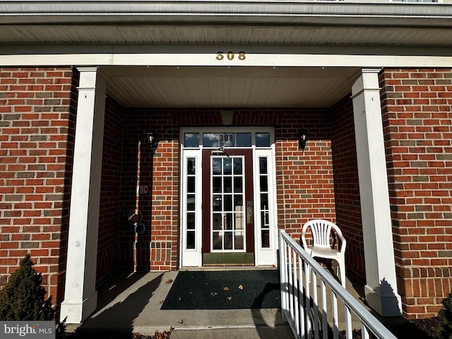 entrance to property featuring a porch