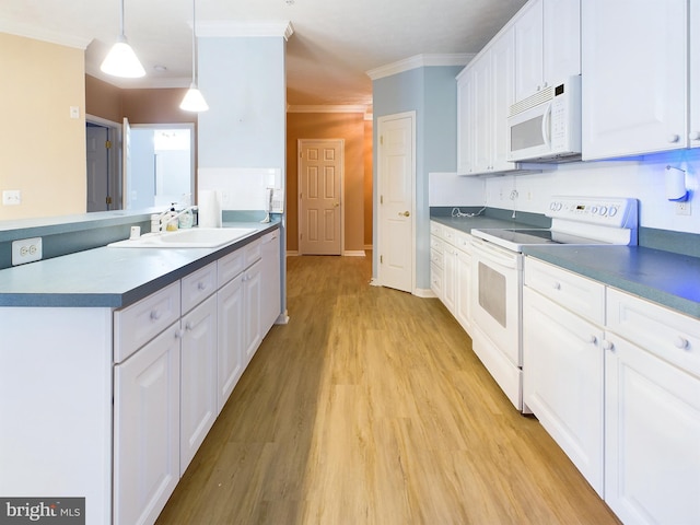 kitchen featuring white cabinets, light wood-type flooring, white appliances, and hanging light fixtures