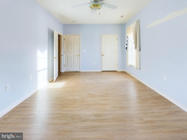 unfurnished room featuring ceiling fan and light hardwood / wood-style floors