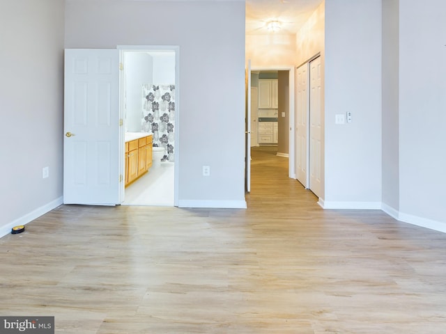 unfurnished room with light hardwood / wood-style floors