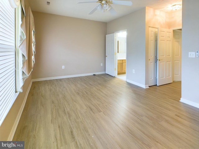 unfurnished room featuring ceiling fan and light hardwood / wood-style flooring