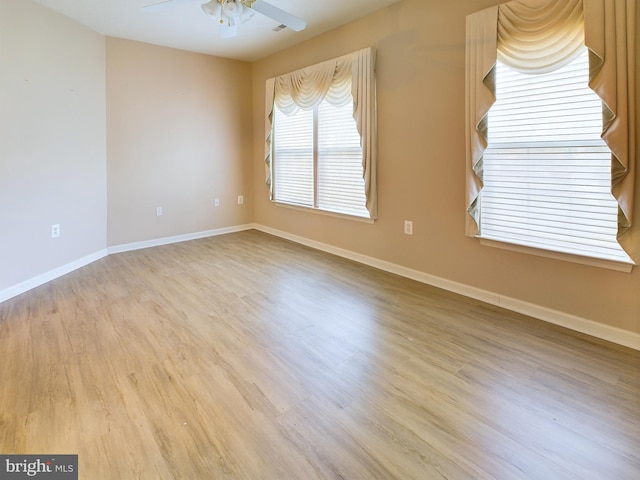 spare room with ceiling fan and light hardwood / wood-style floors