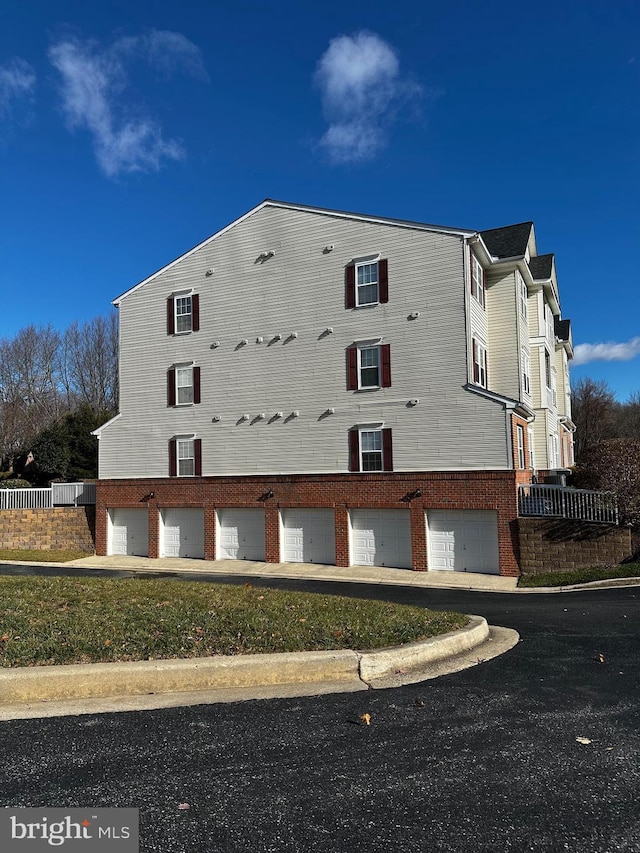 view of side of property featuring a garage