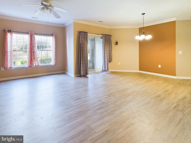 spare room with light hardwood / wood-style floors, ceiling fan with notable chandelier, and ornamental molding