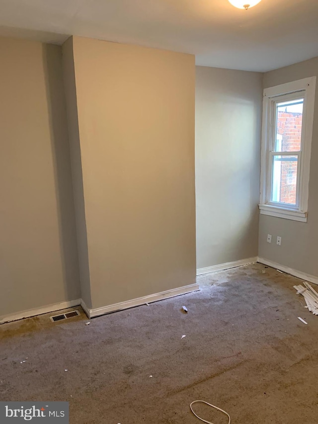 empty room featuring carpet flooring