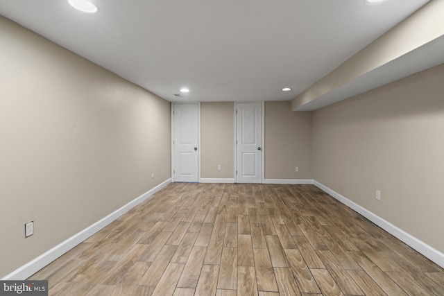 basement featuring light hardwood / wood-style flooring