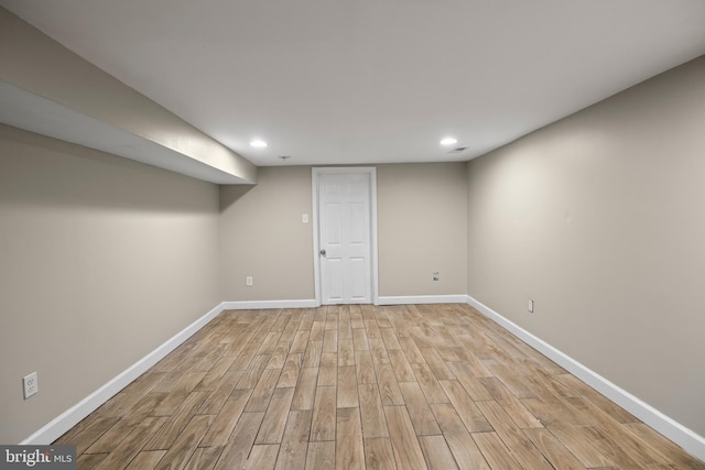 basement featuring light hardwood / wood-style flooring