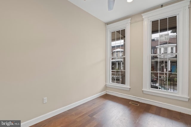 empty room featuring ceiling fan and hardwood / wood-style flooring