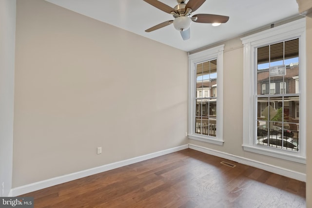 spare room featuring ceiling fan and hardwood / wood-style flooring