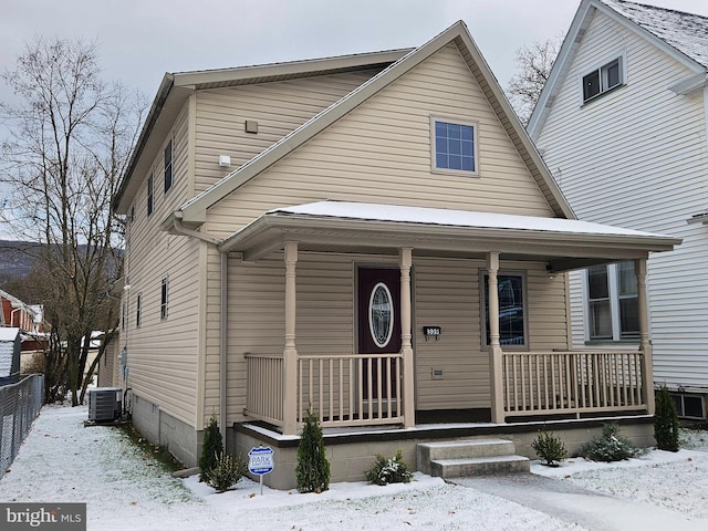 view of front facade featuring central AC and a porch