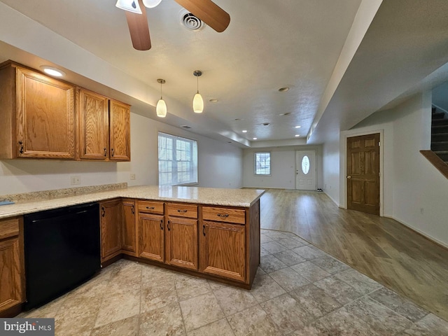 kitchen featuring ceiling fan, dishwasher, hanging light fixtures, kitchen peninsula, and light wood-type flooring