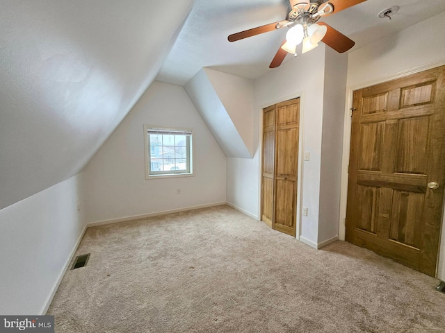 bonus room featuring light carpet, ceiling fan, and lofted ceiling