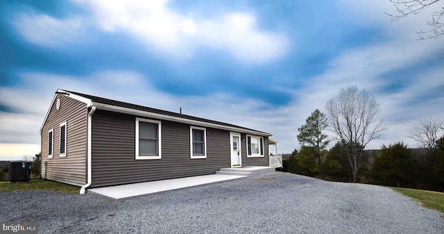 view of front of house featuring a patio and cooling unit