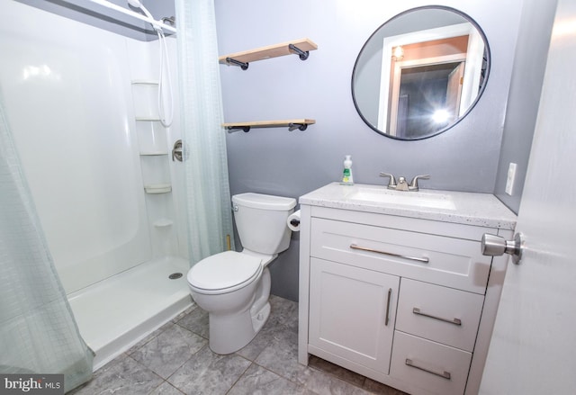 bathroom featuring vanity, curtained shower, and toilet