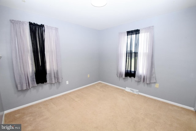 spare room with carpet floors