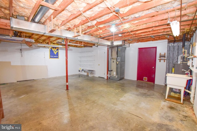 basement with sink and heating unit