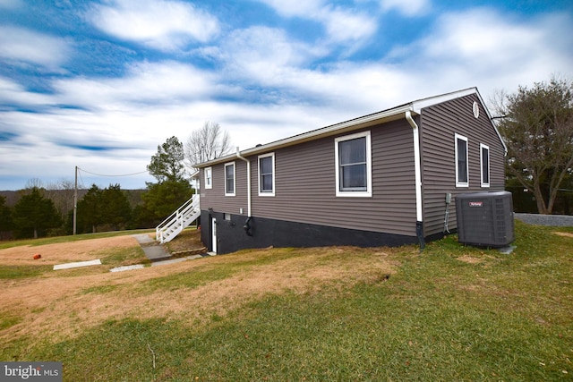 view of property exterior featuring a yard and cooling unit