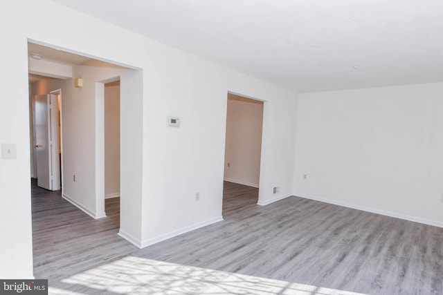 spare room with light hardwood / wood-style floors