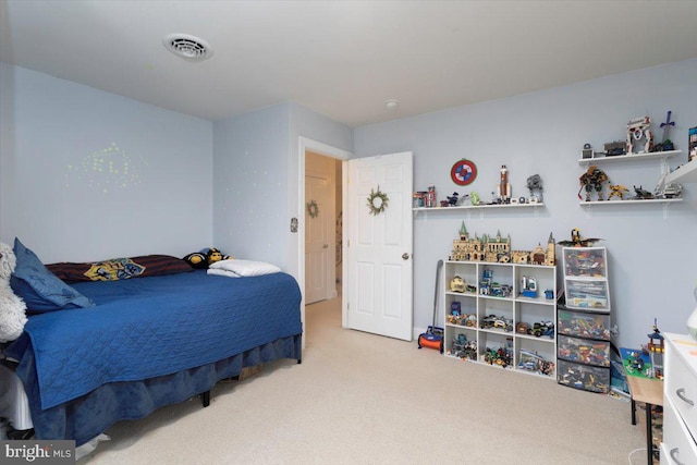 bedroom with light colored carpet