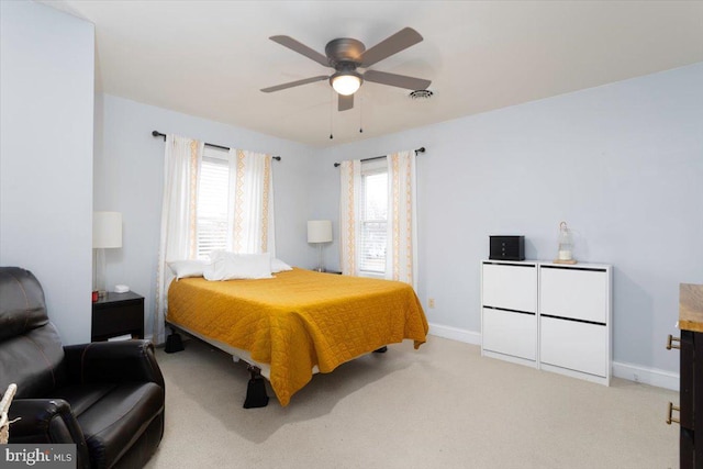 bedroom featuring ceiling fan and light colored carpet