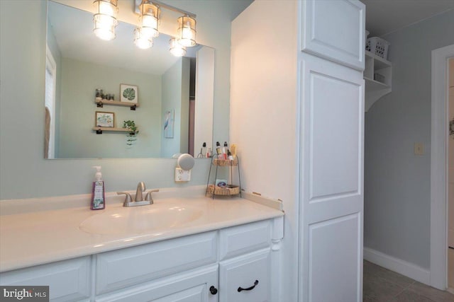 bathroom with tile patterned floors and vanity