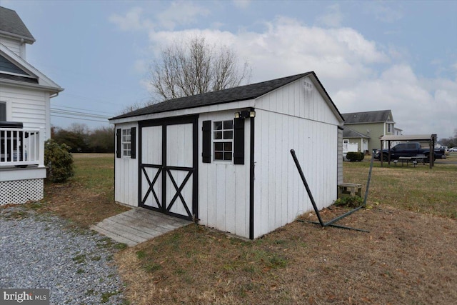 view of outdoor structure with a lawn