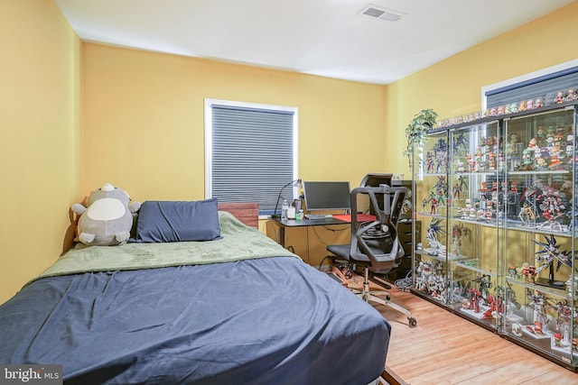 bedroom featuring hardwood / wood-style flooring