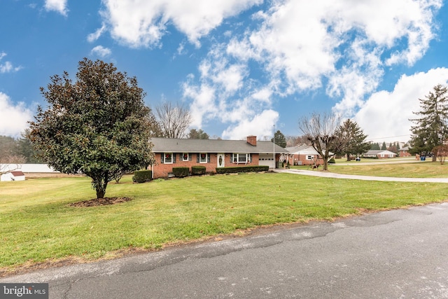 ranch-style home featuring a front yard