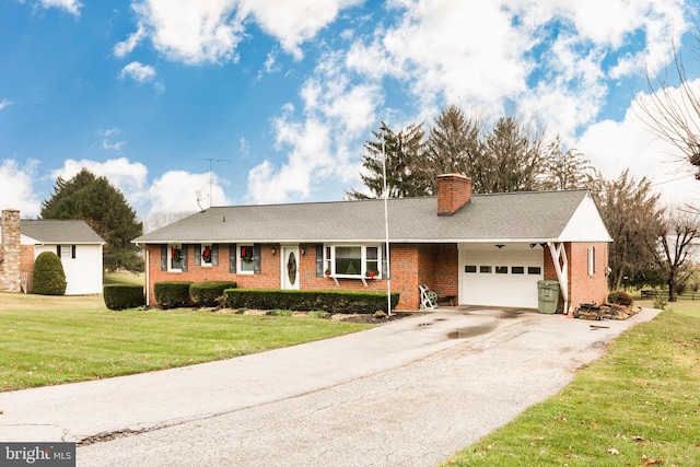 ranch-style home with a front yard and a garage