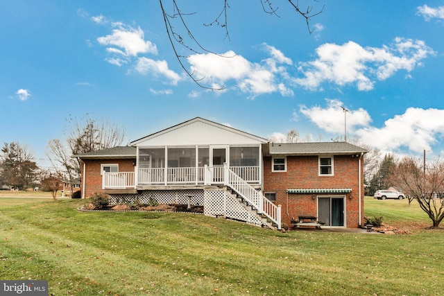 back of house with a sunroom and a yard