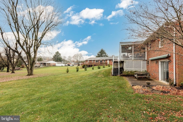 view of yard featuring a sunroom