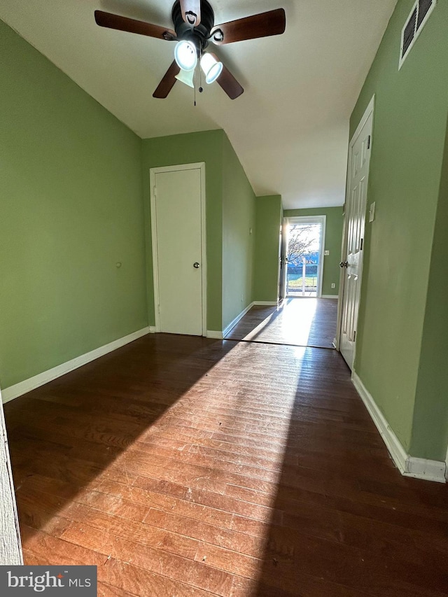 interior space with hardwood / wood-style floors, ceiling fan, and lofted ceiling