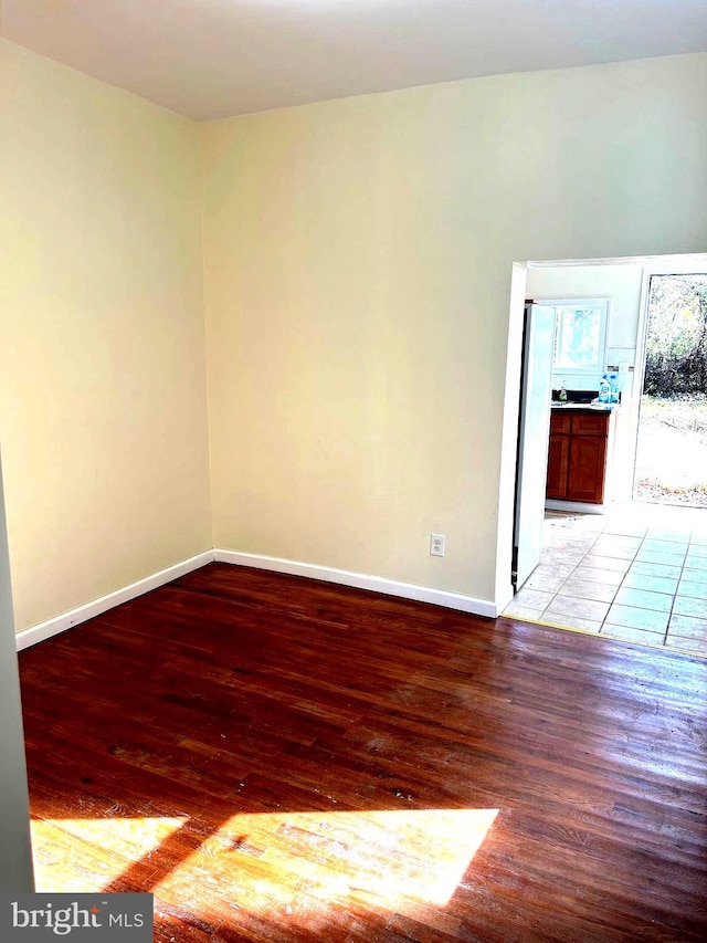 spare room featuring light wood-type flooring