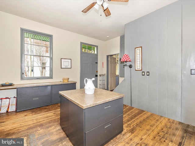 office space featuring ceiling fan and hardwood / wood-style floors