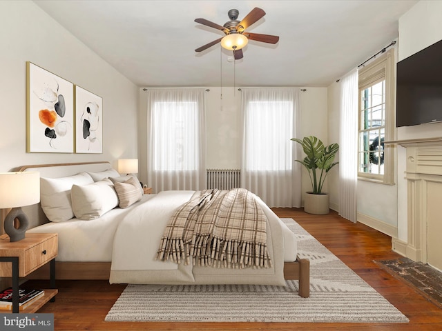 bedroom featuring ceiling fan and dark hardwood / wood-style flooring