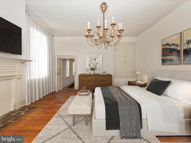 bedroom with hardwood / wood-style flooring and a notable chandelier