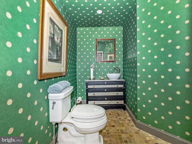 bathroom featuring toilet and sink